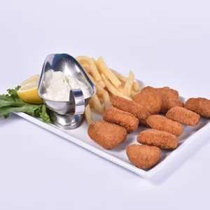 Platter of golden fried chicken strips and french fries served with a silver bowl of creamy garlic dip, garnished with lettuce and lemon on a white background.