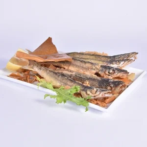 Plated grilled bluefish steaks arranged on a white rectangular plate, topped with toasted flatbread and garnished with fresh lemon slices and curly lettuce on a white background.