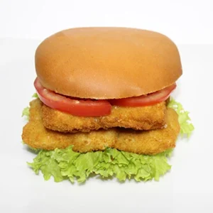 A crispy chicken fillet burger with a golden bun, fresh lettuce, juicy tomato slices, and double crispy chicken fillets on a white plate.