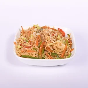A white bowl filled with stir-fried vegetable noodles, carrots, bell peppers, cabbage, and sesame seeds on a white background.