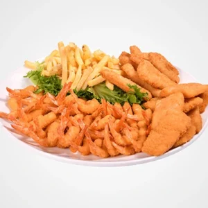 A large white round platter filled with a pile of crispy fried shrimp on the left, golden breaded fish fillets on the right, a mound of french fries at the top, and fresh green lettuce in the center.